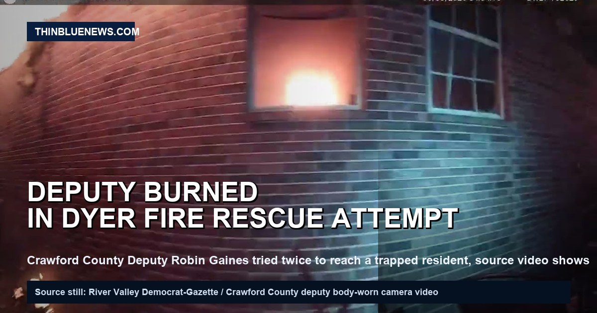 River Valley Democrat-Gazette YouTube still from Crawford County Deputy Robin Gaines’ body-worn camera video showing flames inside a Dyer, Arkansas, home window during a June 3, 2026 rescue attempt; no victim is visible; ThinBlueNews added headline overlay.