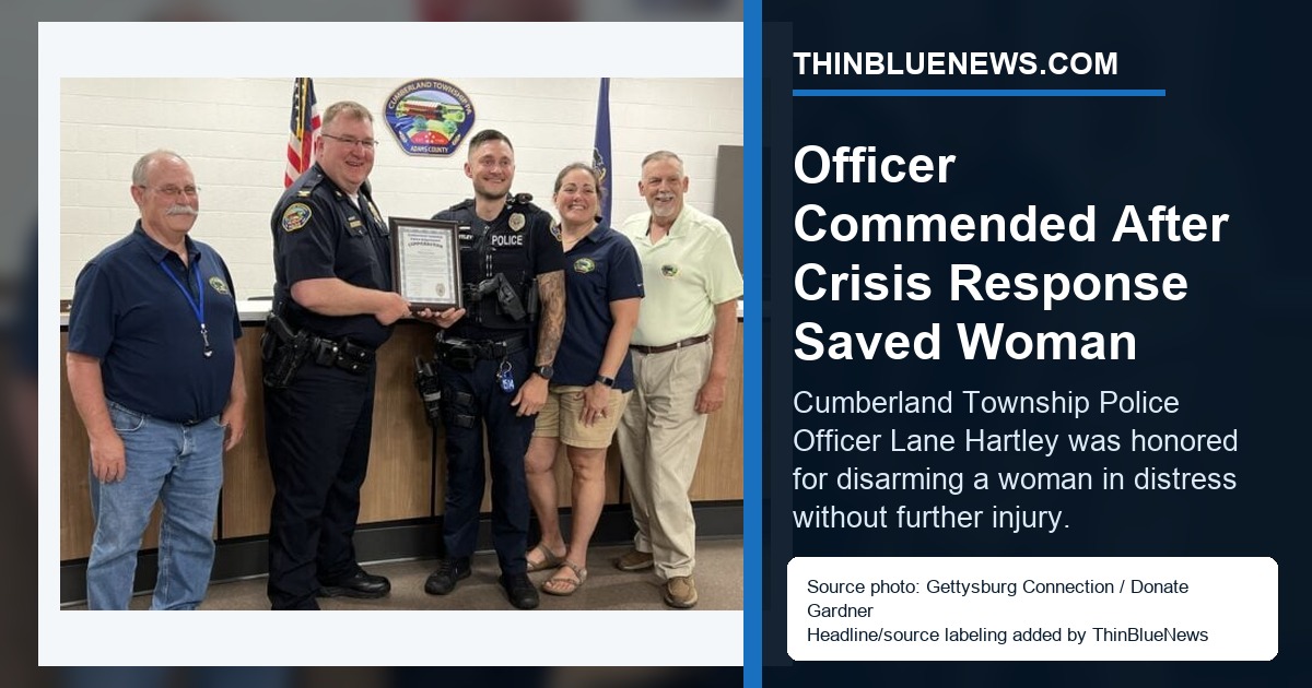 Gettysburg Connection photo by Donate Gardner showing Cumberland Township Police Officer Lane Hartley with township and police officials after a commendation; ThinBlueNews added headline and source labeling.