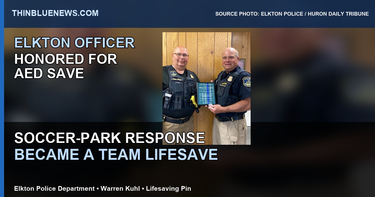 Elkton Police Department courtesy photo published by Huron Daily Tribune showing Officer Warren Kuhl with a lifesaving plaque and pin, with ThinBlueNews headline labeling added.