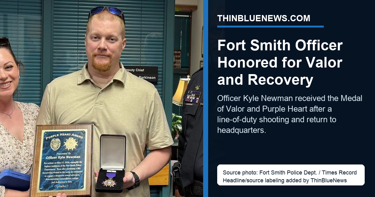 Courtesy Fort Smith Police Department / Times Record source photo showing Officer Kyle Newman receiving the Medal of Valor and Purple Heart from Police Chief Danny Baker, with Newman’s wife Racquel present; ThinBlueNews added headline/source labeling.