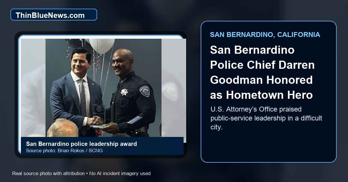 Press-Enterprise and San Bernardino Sun source photo by Brian Rokos showing First Assistant U.S. Attorney Bill Essayli presenting San Bernardino Police Chief Darren Goodman with a Freedom 250 Hometown Hero Award; ThinBlueNews added headline and source labeling.