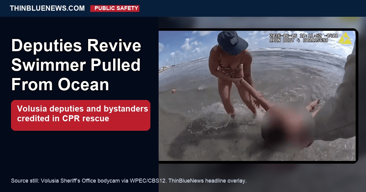 Volusia Sheriff's Office bodycam still published by WPEC/CBS12 showing the ocean rescue response, with ThinBlueNews headline overlay. The rescued swimmer's face is blurred in the source image.
