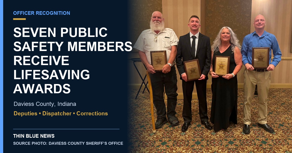 Four Daviess County corrections officers holding Indiana Sheriffs’ Association Lifesaving Award plaques at the 2026 conference