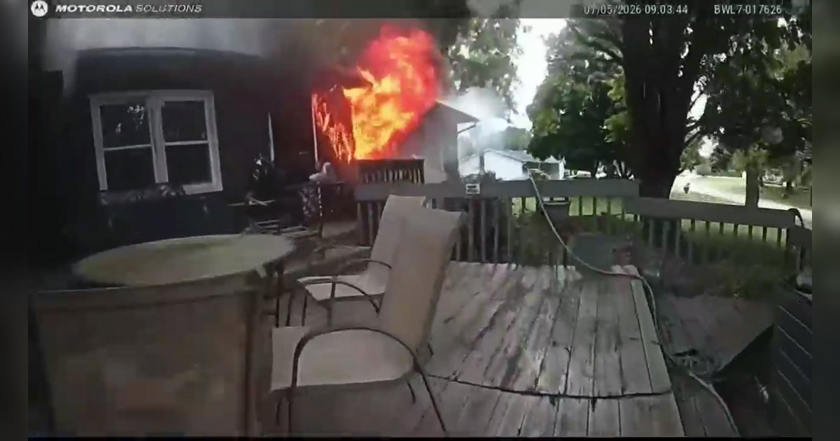True Springfield Township Police body-camera frame showing flames coming from a home during the rescue of a 13-year-old girl
