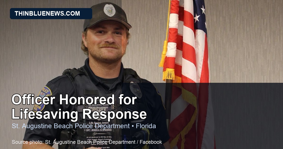 Official St. Augustine Beach Police Department photo showing Officer Josh Schneider holding his Life Saving Award; ThinBlueNews added headline and source labeling.
