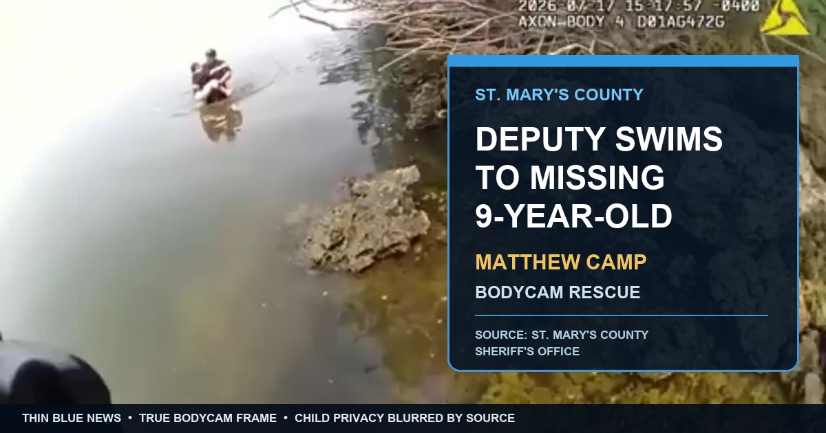 True St. Mary's County Sheriff's Office bodycam frame showing Deputy Matthew Camp carrying a privacy-blurred child through shallow water during the rescue.