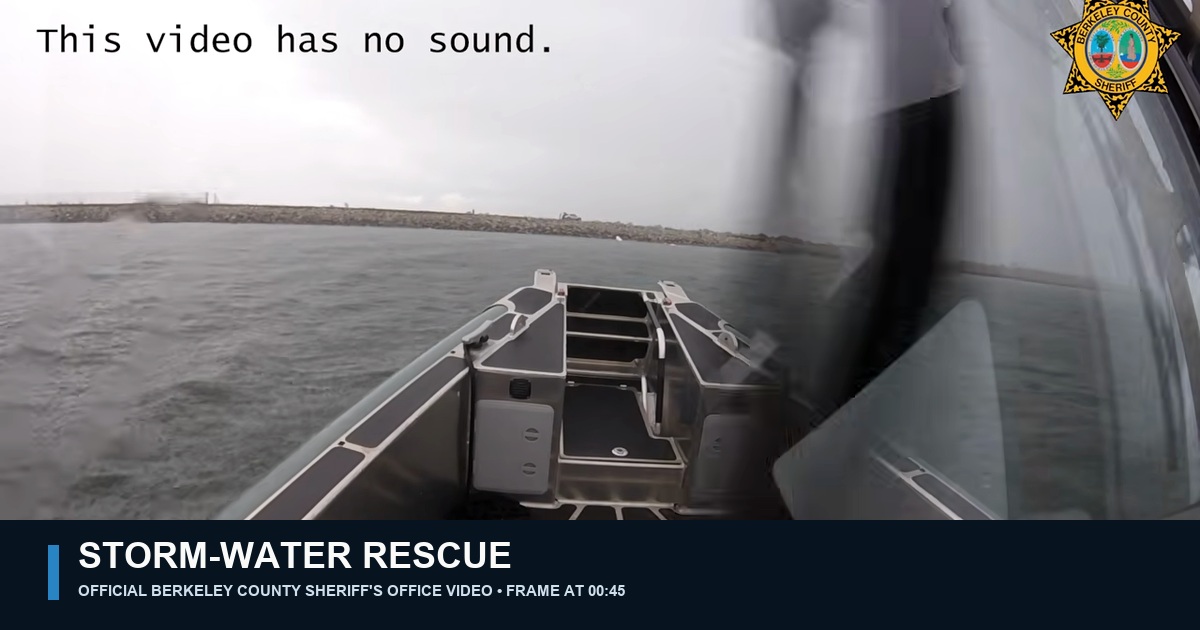 Official Berkeley County Sheriff's Office video frame showing Marine 6's empty bow, rough water and a rocky dike during the storm response; no rescued person is visible.