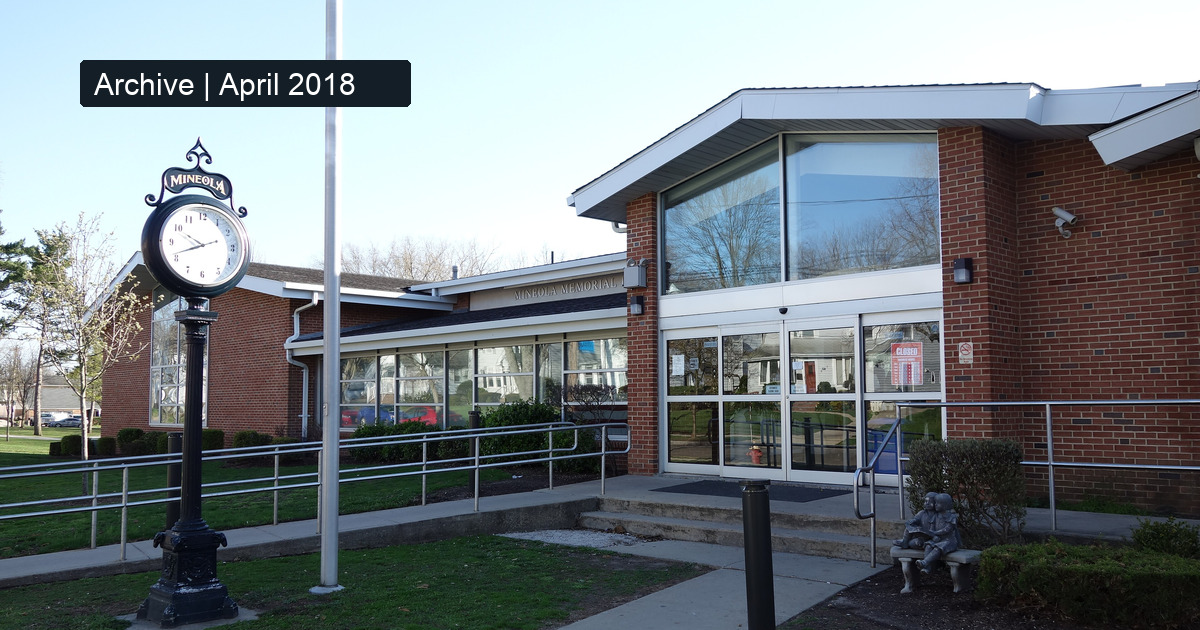 Contextual archive photograph of Mineola Memorial Library, New York, taken April 20, 2018; not the November 12, 2026 meeting or evidence of current building conditions.