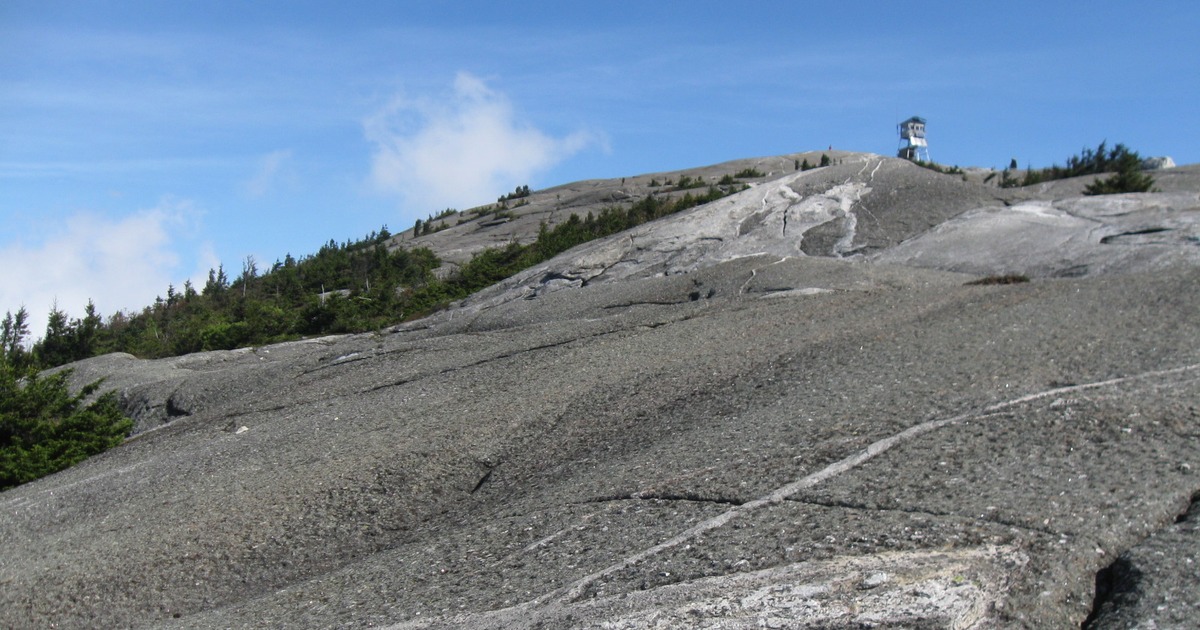 Contextual file photograph of exposed rock near Mount Cardigan summit; not the October 25, 2026 rescue or the Holt Trail incident site.